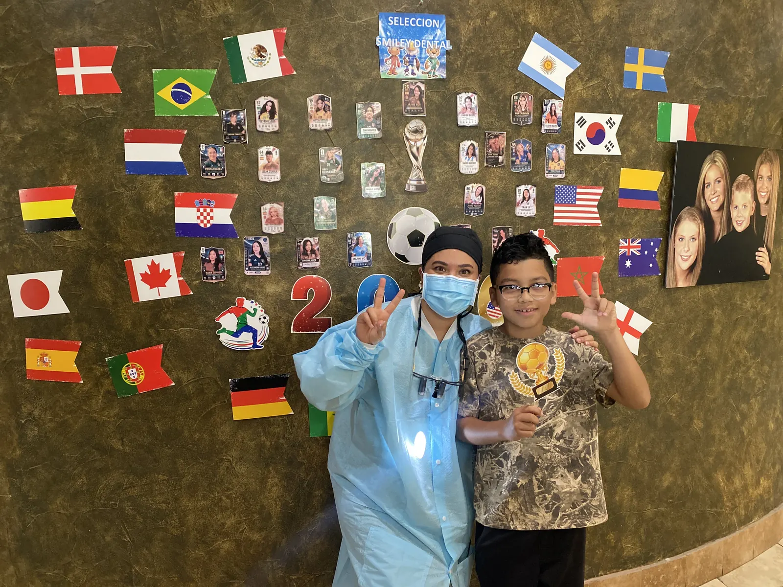 Smiley Dental team member celebrating with a young patient